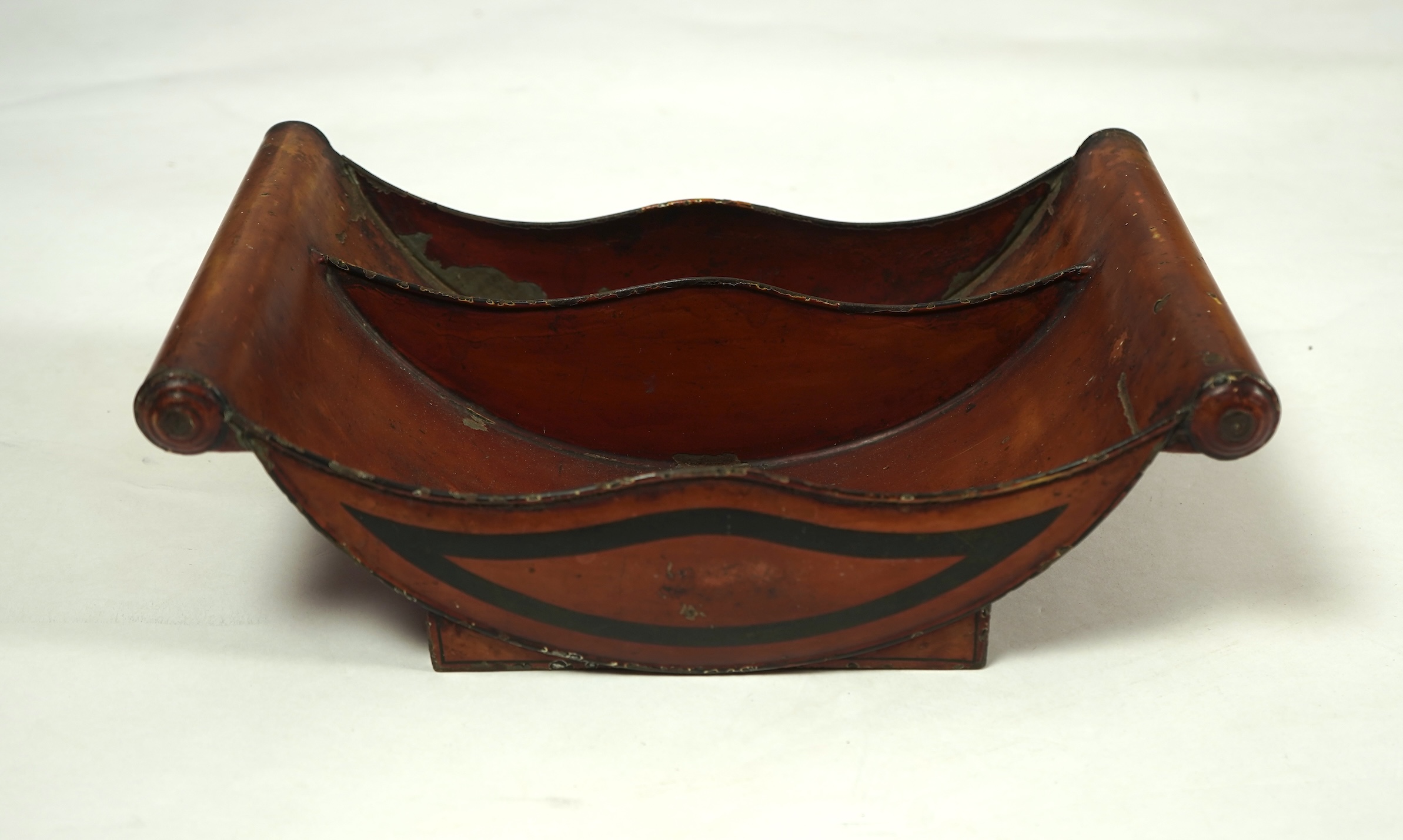 A pair of early 19th century Dutch japanned pewter chest urns and covers, and a tole ware cheese coaster